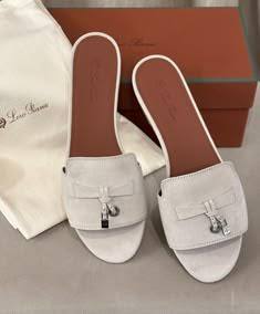 The item in the image is the Loro Piana Summer Charms Suede Slide Sandals